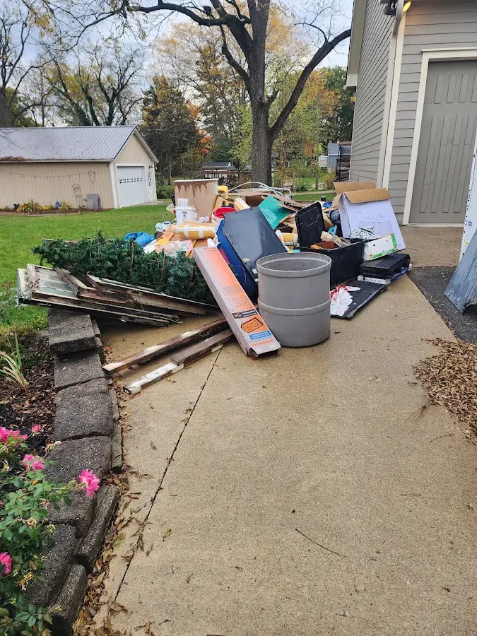 Dumpster being loaded with debris for 30 Yard Dumpster Rental in Melbourne